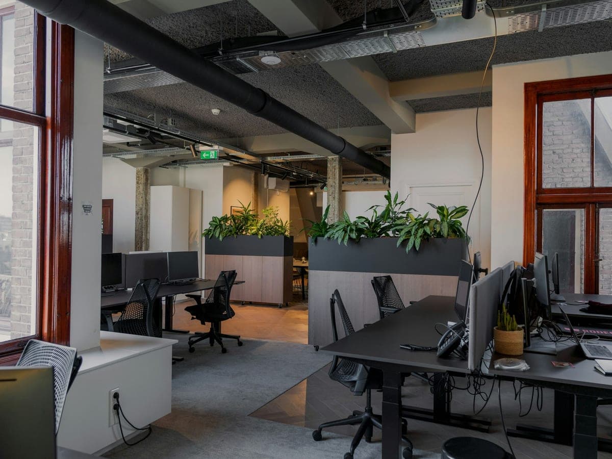 An open-plan office with several workstations